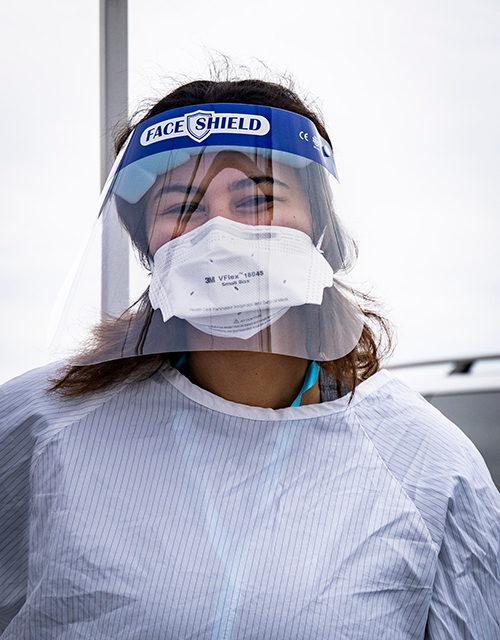 Volunteer COVID tester in PPE.